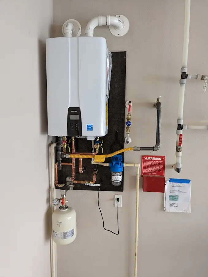 Professional plumber installing copper piping in a St. Augustine Beach home